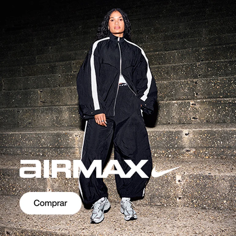 Modelo usando conjunto esportivo Nike preto com detalhes brancos e tênis Nike Air Max claros, em pé sobre uma escadaria escura. O banner exibe o logotipo Air Max e um botão “Comprar”.