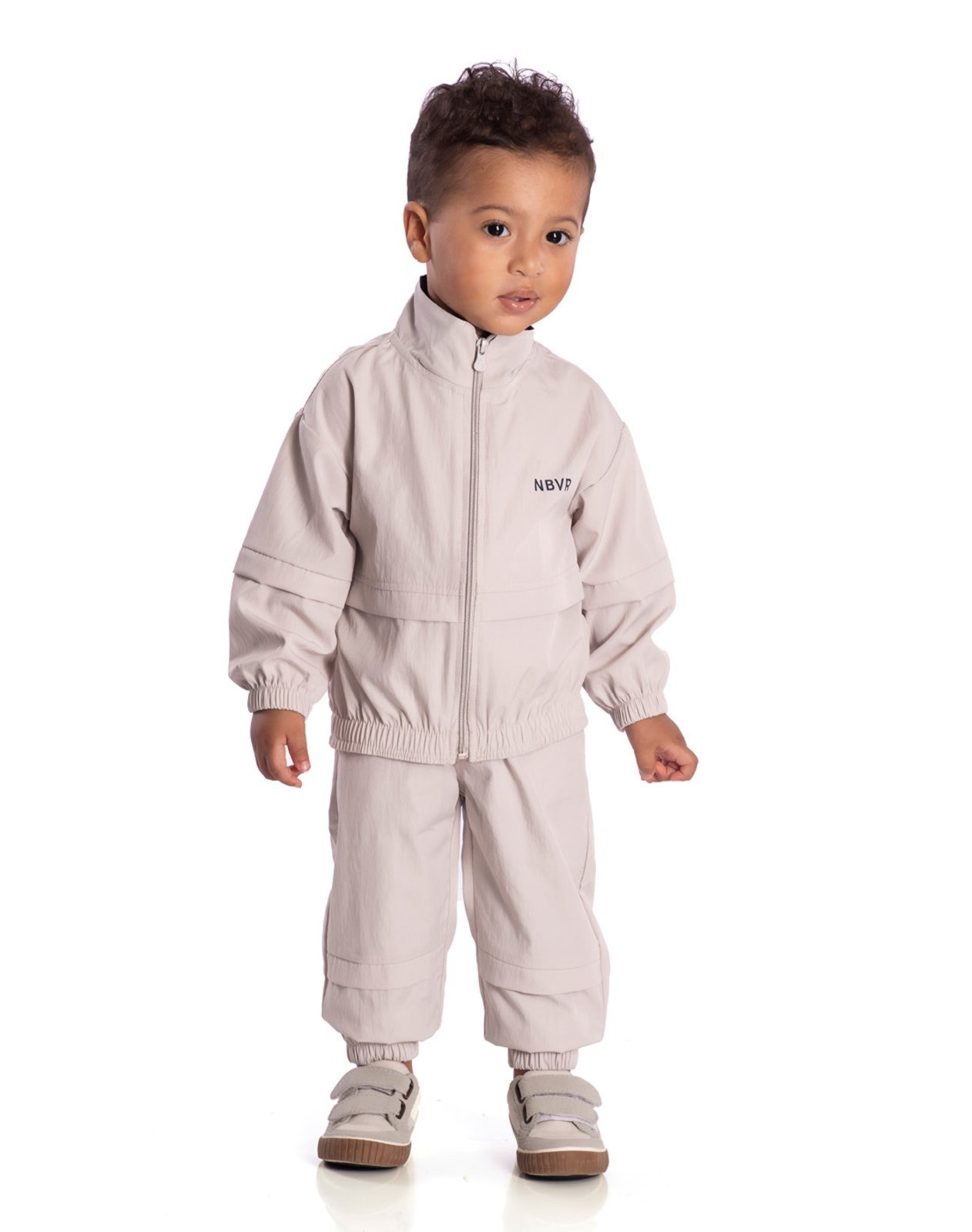 Infantil - Conj. jaqueta corta vento + calça bege claro