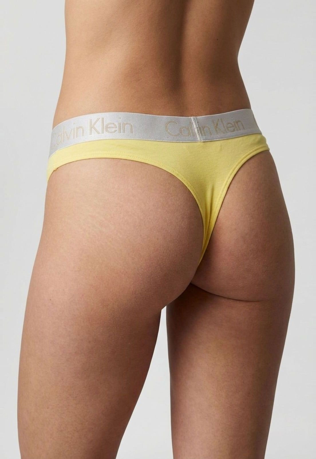 Vista 3 Calcinha Feminina Calvin Klein Tanga Cotton CK Reveillon Amarela Calvin Klein Underwear amarelo Calvin Klein Underwear amarelo